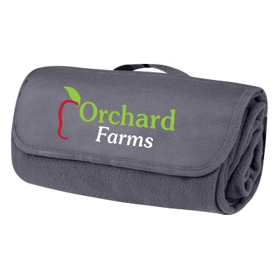 Full color logo on front closing flap of the navy blue fleece blanket with a handle.