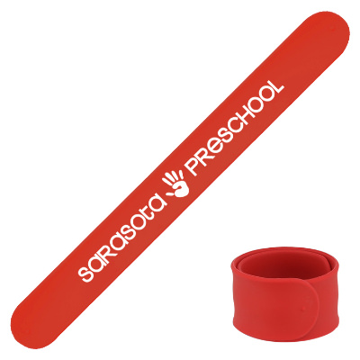 Red silicone wristband with a personalized logo.