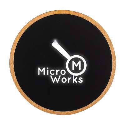 Maple plastic wireless charger with an engraved logo.