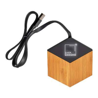 Black bamboo wireless charger with an engraved logo.