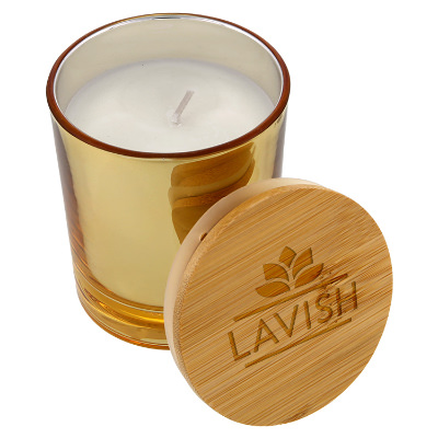 Gold glass candle with a personalized imprint.