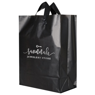 Plastic black colored frosted foil stamped shopper bag imprinted.
