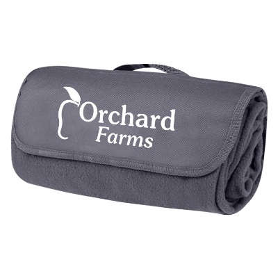 Customized logo on front closing flap of the navy blue fleece blanket with a handle.