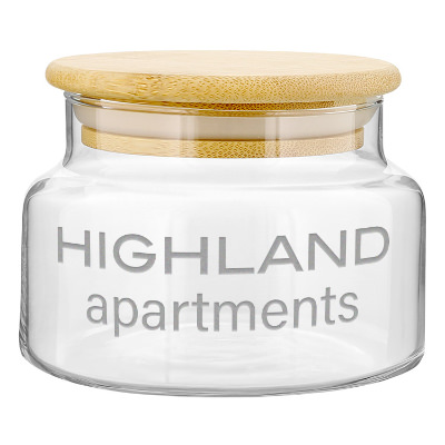 Clear glass jar with a custom logo.