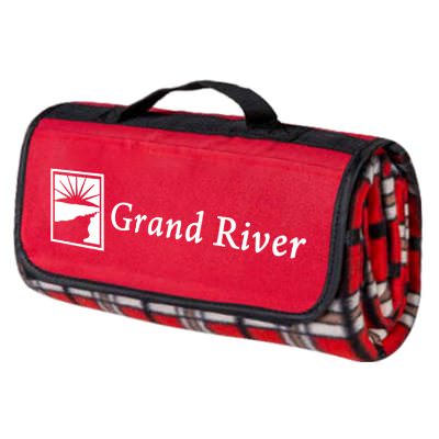 Plaid polyester water-resistant picnic blanket with a velcro closure, a customized flap with a front pocket.