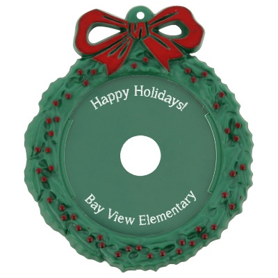 Green plastic ornament with a branded imprint