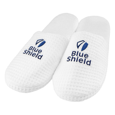 White slippers with custom imprint.