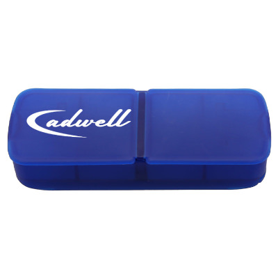 Blue plastic pill box with a branded imprint.