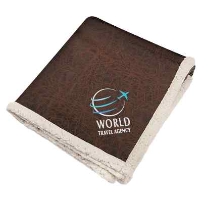 Brown leather throw blanket with embroidered logo.