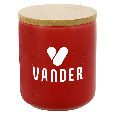 Red glass candle with a custom logo.