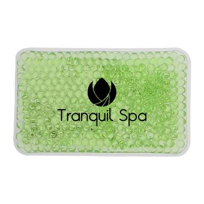 Plastic green hot and cold pack with a custom imprint.