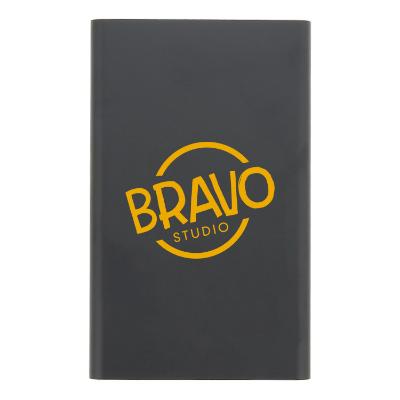 Metal black compact power bank with printed logo.