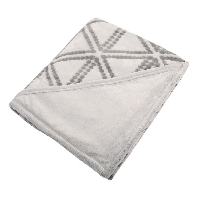 Tan and white ultra blank plush blanket.