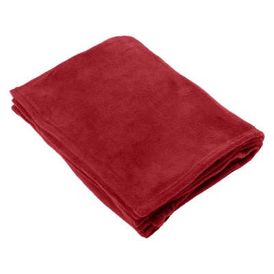 Forest green plush polyester blanket.