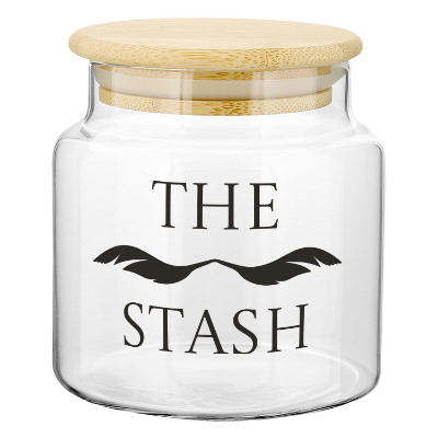 Clear glass jar with a branded logo.