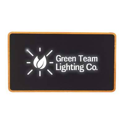 Black plastic power bank with an engraved logo.