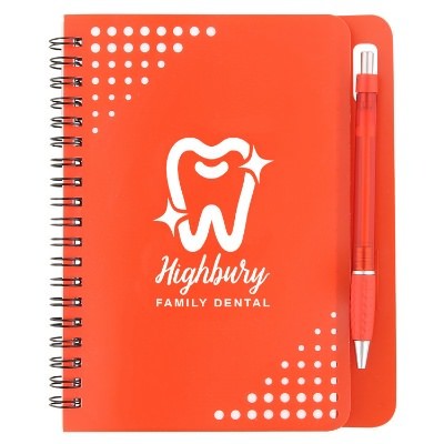 Customized red notebook with pen.