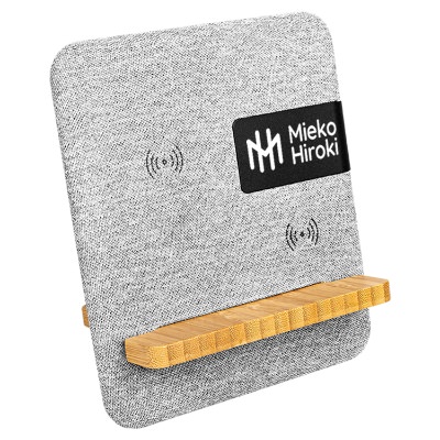 Gray bamboo wireless charger with a branded imprint.