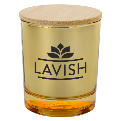 Gold glass candle with a personalized imprint.
