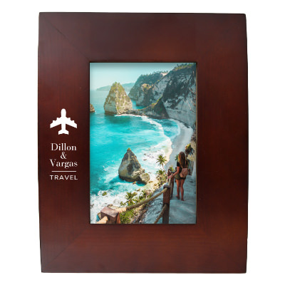 Walnut wooden picture frame with a personalized imprint.