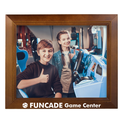 Walnut wooden picture frame with a personalized imprint.