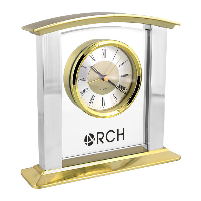 Gold glass clock with a branded imprint.