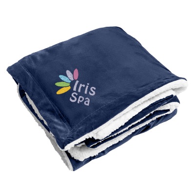 Royal blue embroidered sherpa blanket.