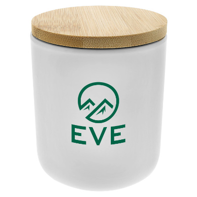 White ceramic candle with a branded imprint.