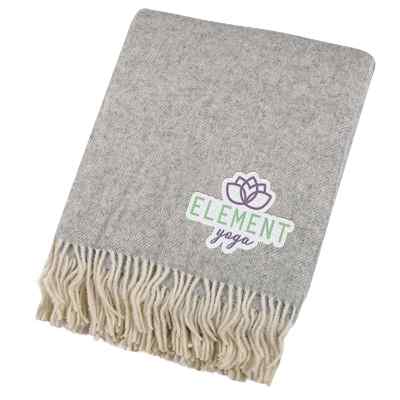 Wool herringbone fringe blanket with custom embroidered logo.