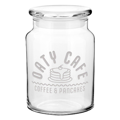 Clear glass jar with a branded imprint.