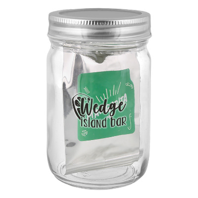 Clear glass majon jar with a branded logo.