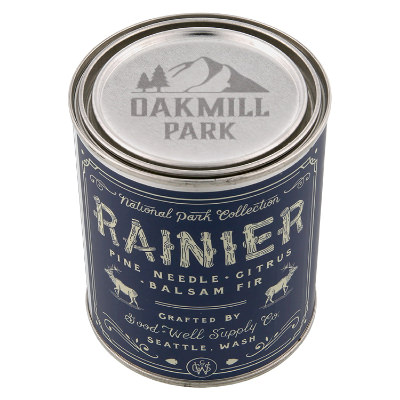Silver metal candle with a branded imprint.
