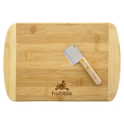 Tan bamboo charcuterie board with a personalized logo.