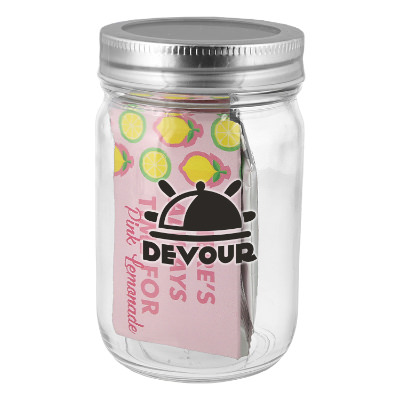 Clear glass majon jar with a branded logo.