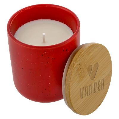 Red glass candle with a custom logo.