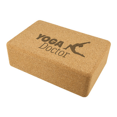 Cork yoga block with custom engraved logo.
