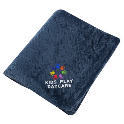Blue etch textured blanket with embroidered design.