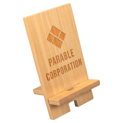 Bamboo phone stand with a custom engraved logo.