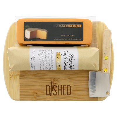 Tan bamboo charcuterie board with a personalized logo.