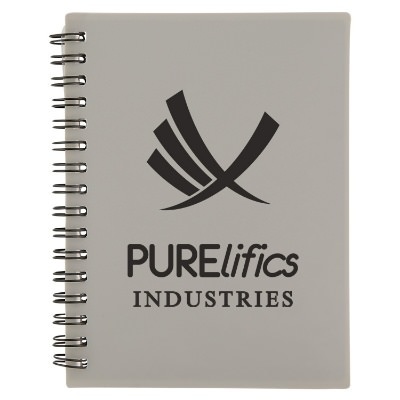 Small purple notebook with zipper pocket and logo.