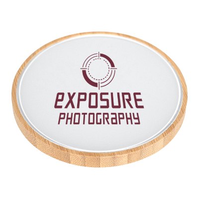 Bamboo wireless charger with a personalized logo.