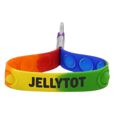 Rainbow silicone wristband with a personalized imprint.