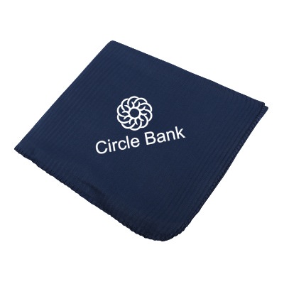 Navy blue ribbed fleece blanket with custom logo.