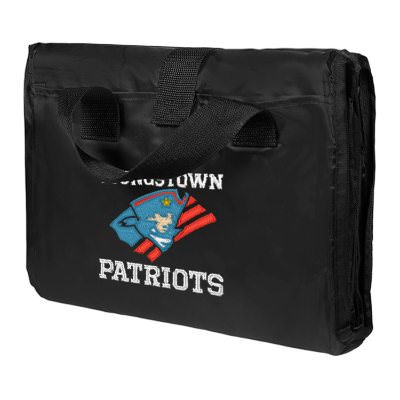 Embroidered fleece blanket with nylon outer shell that can fold within itself with attached handles.