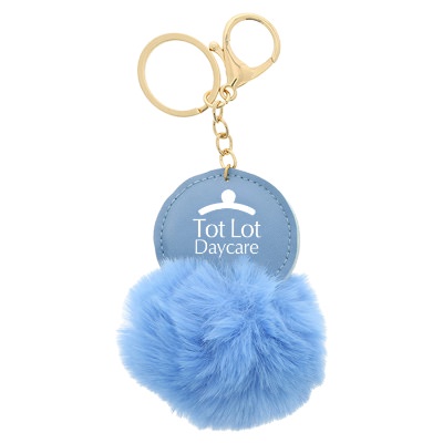 Key ring with blue fluff ball with promotional imprint.