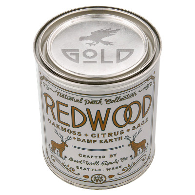 Silver metal candle with a branded imprint.