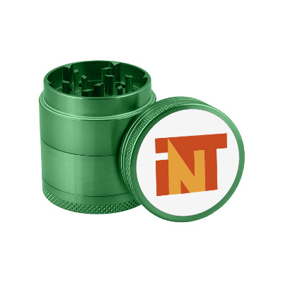 Green metal grinder with custom full color logo.