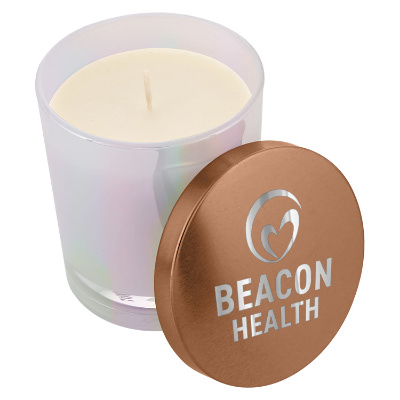Copper glass candle with a branded logo.
