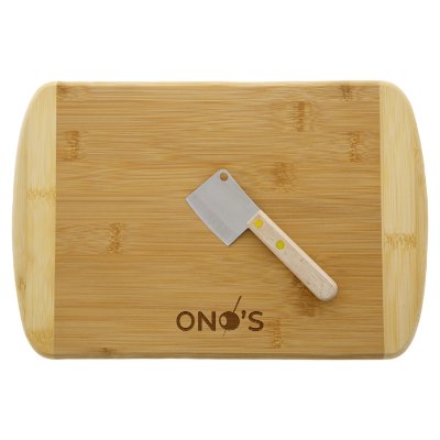Tan bamboo charcuterie board with a personalized logo.