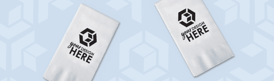Muliple white linen like napkins with light blue imprint